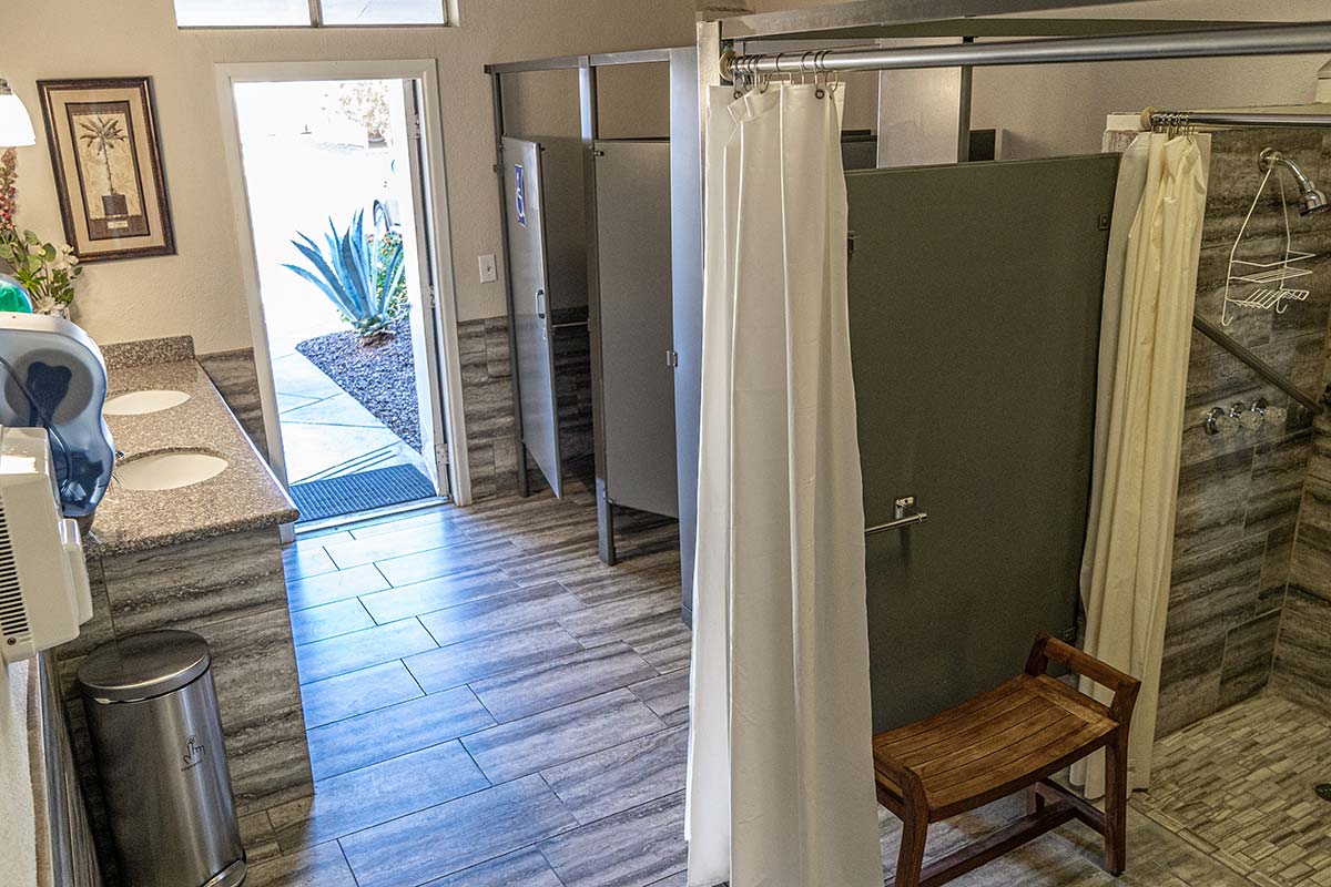 Full bathroom and shower area next to El Dorado Mobile Estates & RV Park's pool