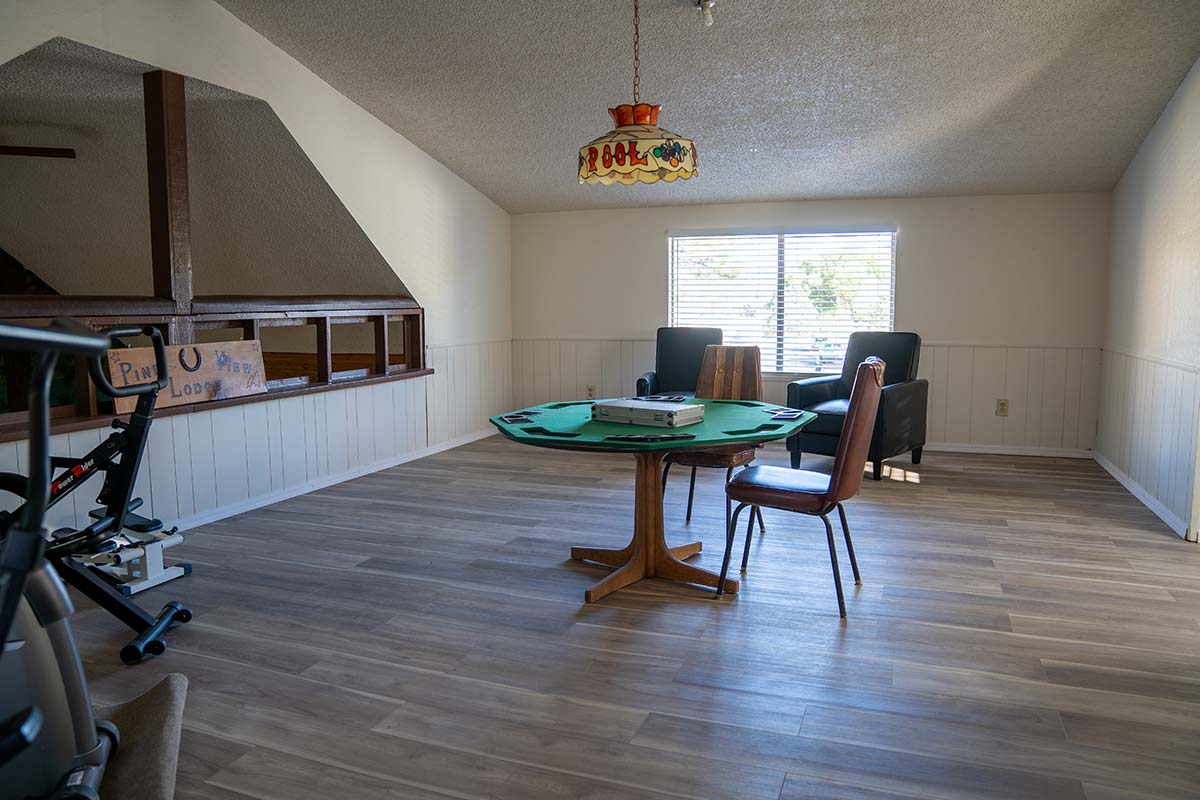 Lodge loft with card table, exercise equipment and sitting area