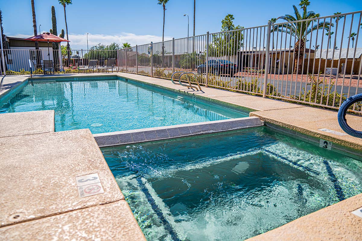 Waterfall edge pool flowing into therapeutic spa at Sierra Leone RV Park